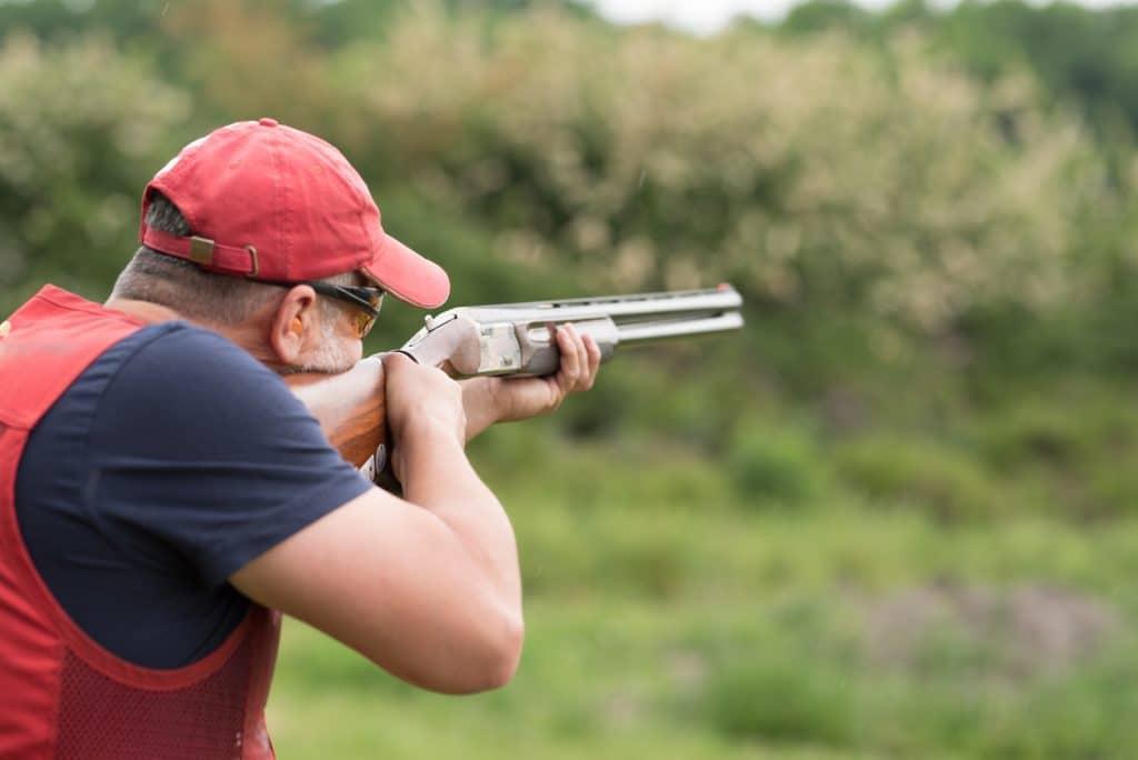 Shooting skeet with a double gun.