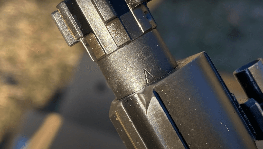 Bolt markings on the Colt, which designate the possible sub-contractor who produced the bolt itself.