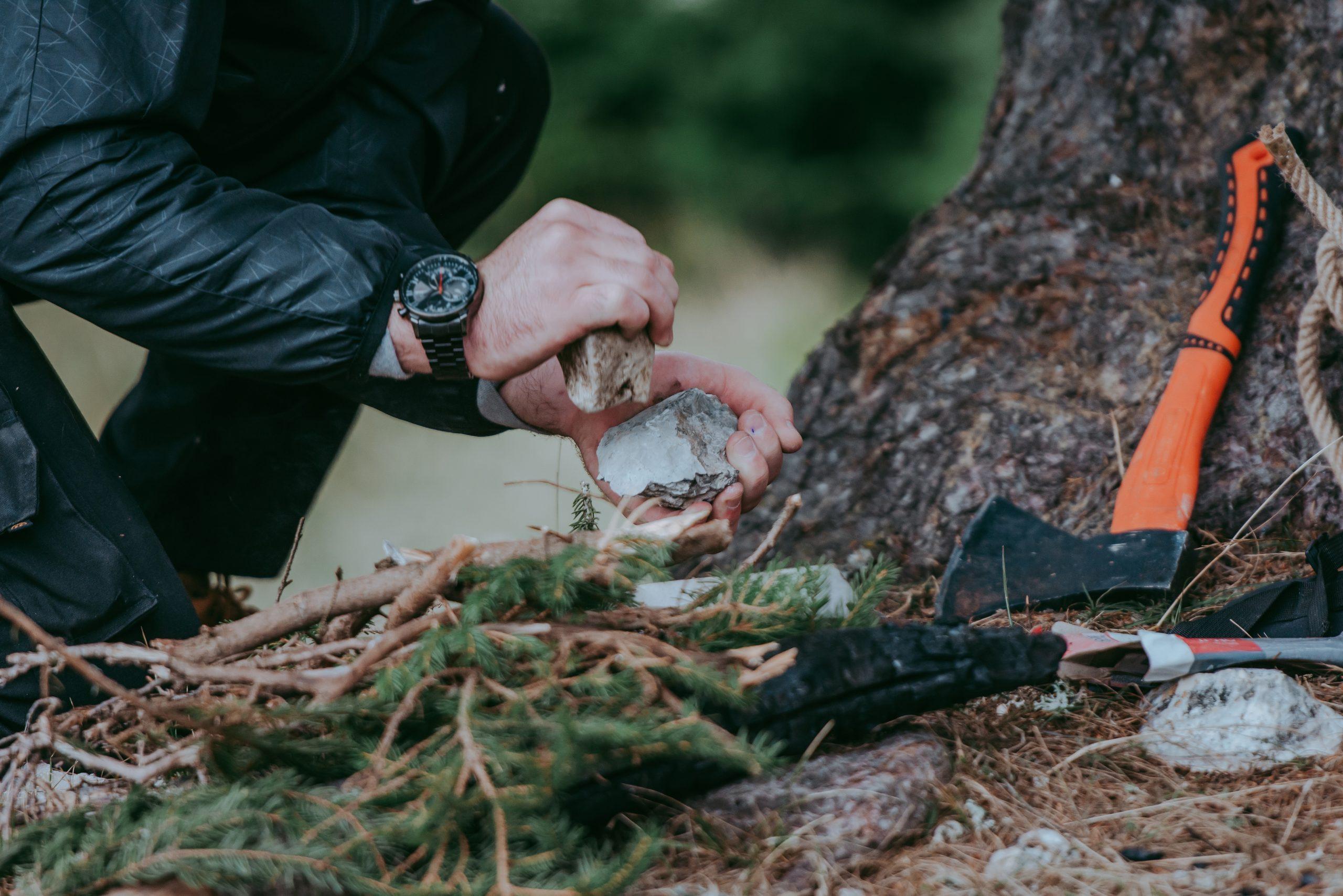 Serious,Young,Bearded,Hiker,In,Cap,Setting,Fire,In,The