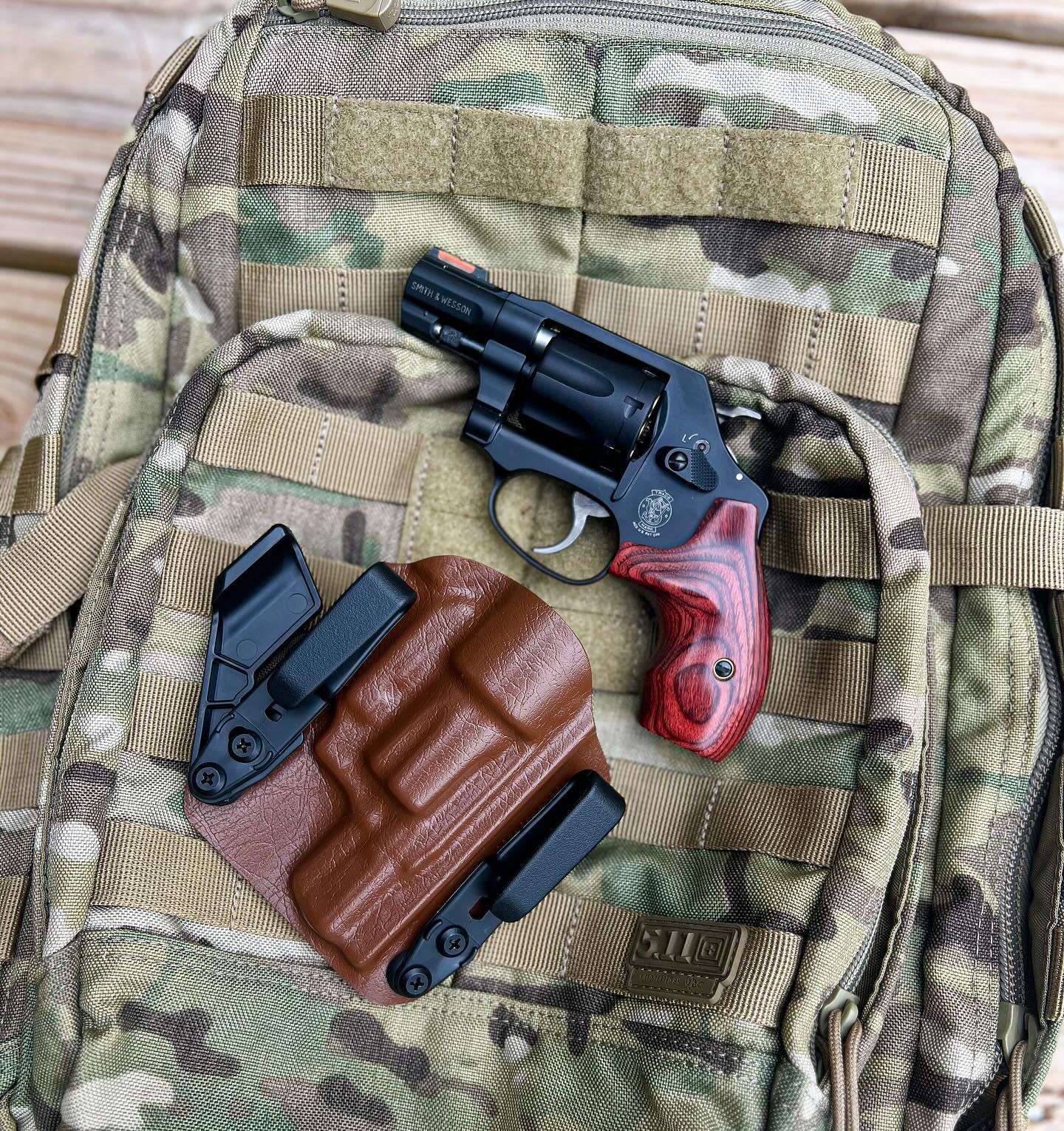 A S&W J-Frame revolver (or similar) is easy to conceal and works well for a backpacking piece.