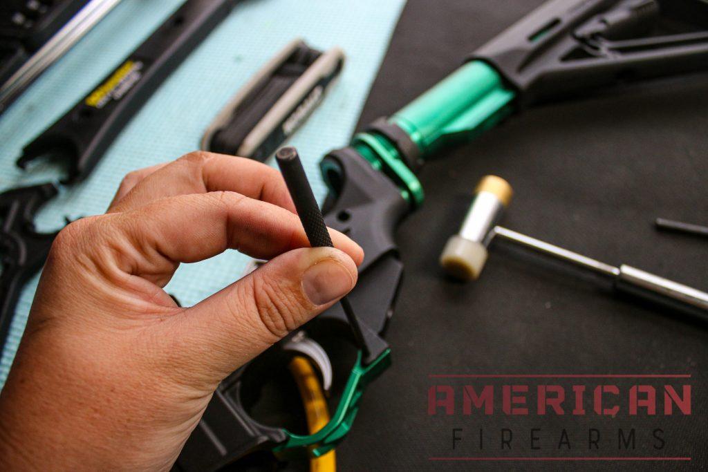 Line up the other holes and hammer in the roll pin to keep that end in place.