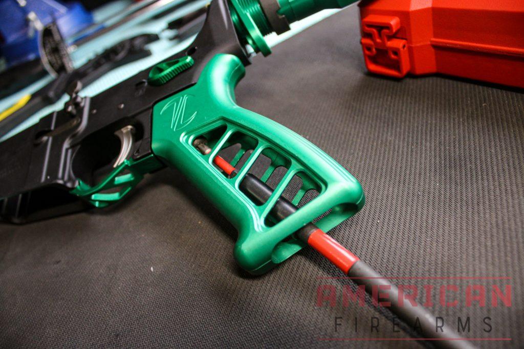 Be careful to push down as you screw in the grip screw to prevent the safety spring from coming out.