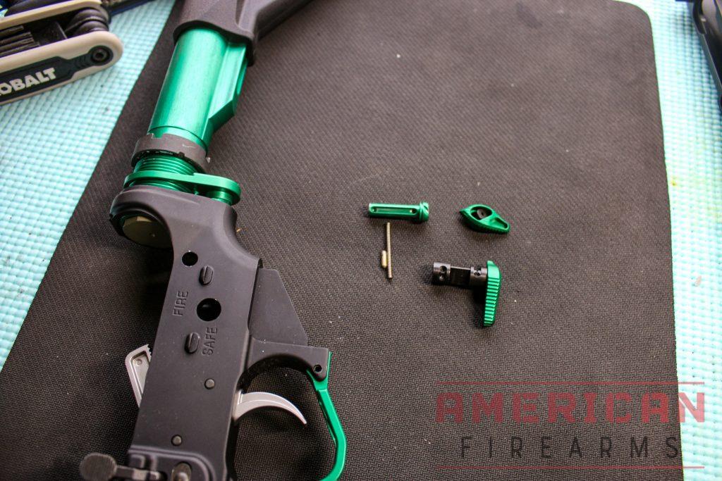 Screw the buffer tube into the lower assembly. Safety assembly stands ready.