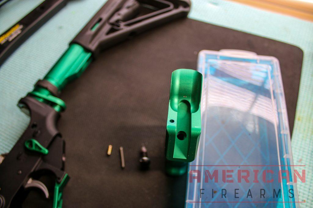 If you look at the top of your grip, you’ll see a small hole on top. Insert the safety spring into the hole.