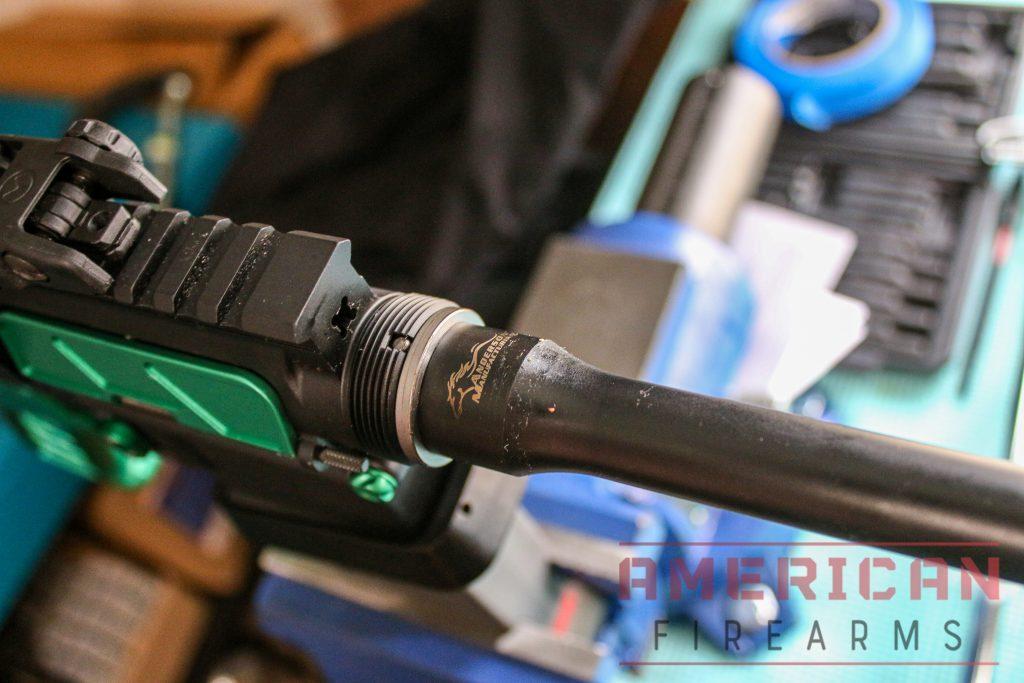 Push the barrel into this notch until the threads and barrel are flush.