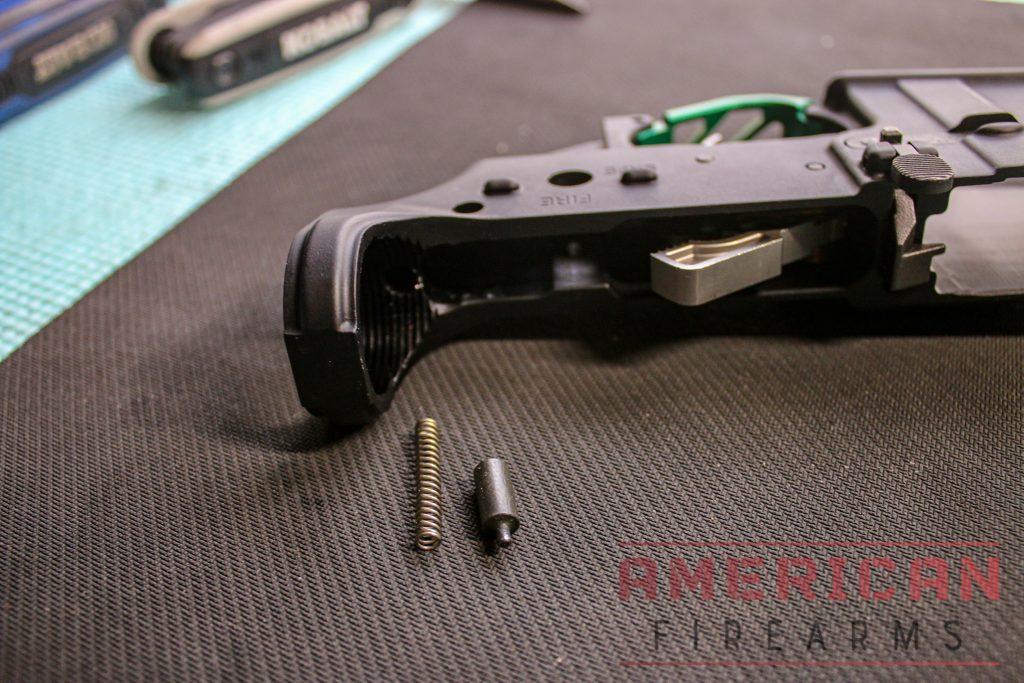 The buffer tube retaining spring and retainer itself are placed in the small hole in the lower.