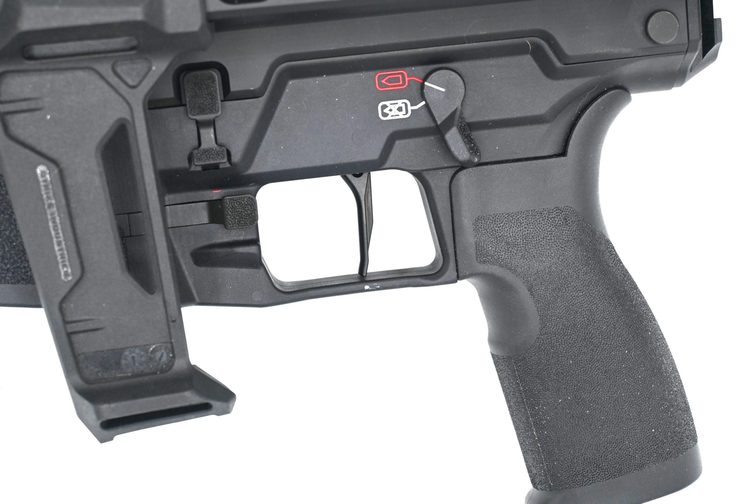 The flat-faced aluminum trigger breaks cleanly around 6.5 pounds.