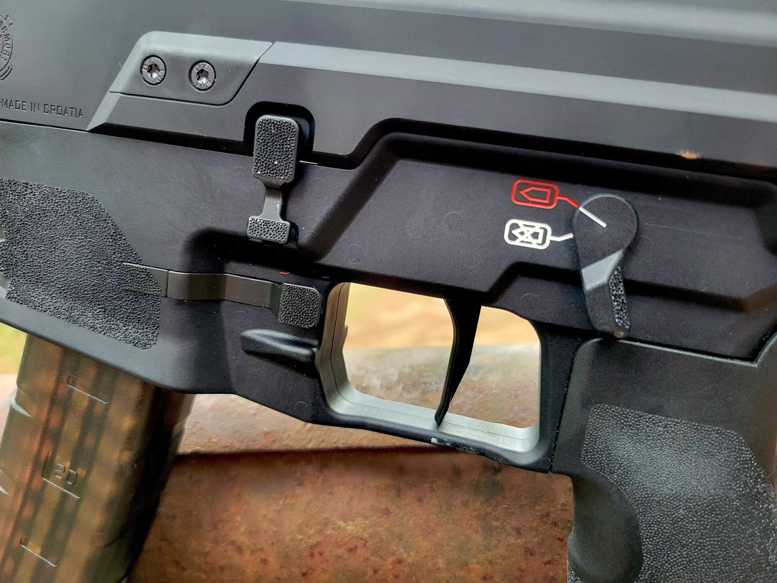 The HK-style safety levers mirror each other on both sides.